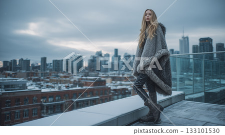 Female model overlooking the city in winter | Cool and sophisticated urban style portrait 133101530