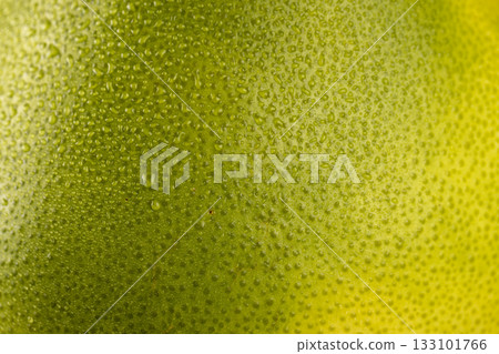 the wet, beautiful citrus peel is yellow and green, the peel is covered with water droplets the wet, beautiful citrus peel is yellow and green, the peel is covered with water droplets 133101766