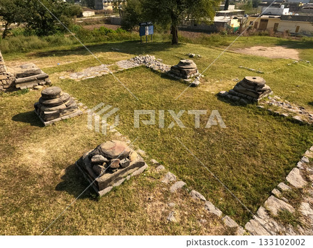 Entrance view Jandial temple Taxila Pakistan stone stumps Entrance view Jandial temple Taxila Pakistan stone stumps 133102002