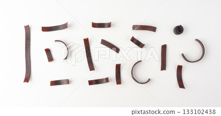 Fruit leather rolls isolated. Plum apple pastila, pastille healthy candy snack Fruit leather rolls isolated. Plum apple pastila, pastille healthy candy snack 133102438