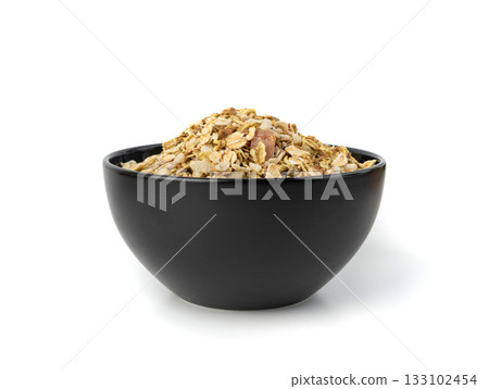 Muesli isolated. Crunchy granola with cereal mix, oat flakes, dry fruits, berries and fiber 133102454