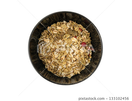 Muesli isolated. Crunchy granola with cereal mix, oat flakes, dry fruits, berries and fiber Muesli isolated. Crunchy granola with cereal mix, oat flakes, dry fruits, berries and fiber 133102456