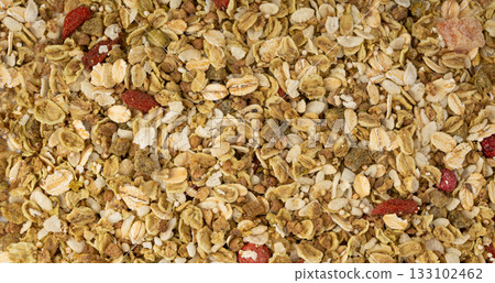 Muesli isolated. Crunchy granola with cereal mix, oat flakes, dry fruits, berries and fiber Muesli isolated. Crunchy granola with cereal mix, oat flakes, dry fruits, berries and fiber 133102462