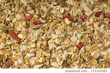Muesli isolated. Crunchy granola with cereal mix, oat flakes, dry fruits, berries and fiber Muesli isolated. Crunchy granola with cereal mix, oat flakes, dry fruits, berries and fiber 133102463