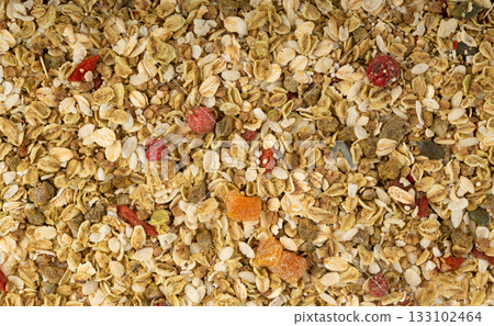 Muesli isolated. Crunchy granola with cereal mix, oat flakes, dry fruits, berries and fiber Muesli isolated. Crunchy granola with cereal mix, oat flakes, dry fruits, berries and fiber 133102464
