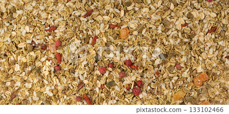 Muesli isolated. Crunchy granola with cereal mix, oat flakes, dry fruits, berries and fiber 133102466