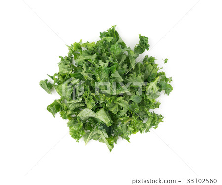 Pieces of kale cabbage leaves isolated. Green leaf of curly cabbage cooked for fresh salad 133102560