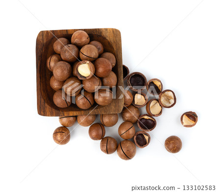 Macadamia nuts isolated. Natural raw peeled macadamia seeds and shells 133102583