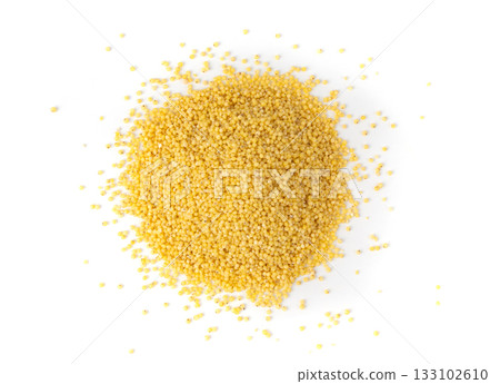 Raw millet grains pile isolated. Little yellow cereal, natural foxtail small seeds 133102610