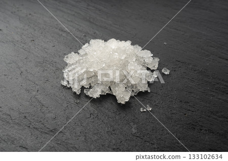 Dead sea salt pile, white crystals for body spa, sodium chloride similar to crushed ice, spa scrub 133102634