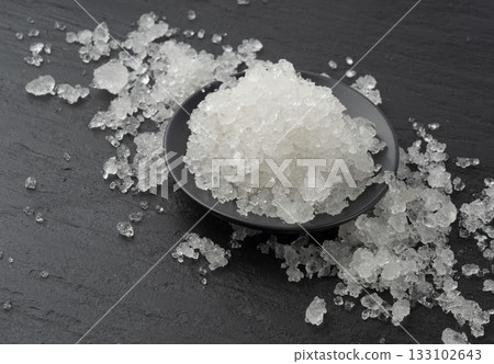 Dead sea salt pile, white crystals for body spa, sodium chloride similar to crushed ice, spa scrub 133102643