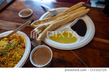 Fafda Indian snack food made from chickpea flour with spices. Faafda crispy sticks or fafda 133102720