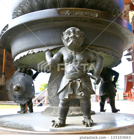 Incense burner outside the feet of the demons at the Great Buddha Hall 133103663