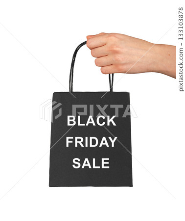 Hand holding black paper bag with Black Friday Sale text, minimal modern design concept for retail 133103878