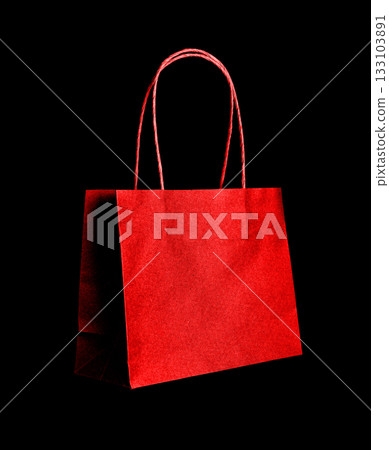 Red paper shopping bag on dark background, symbol of desire, passion and consumerism, concept of Red paper shopping bag on dark background, symbol of desire, passion and consumerism, concept of 133103891
