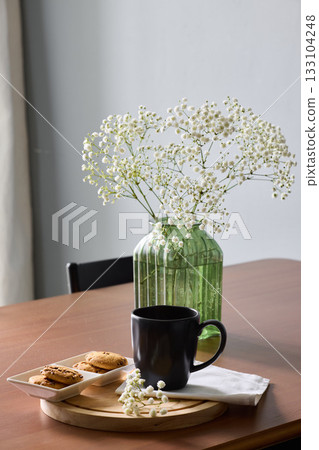 Tranquil still life showcasing morning treats and cozy decor 133104248