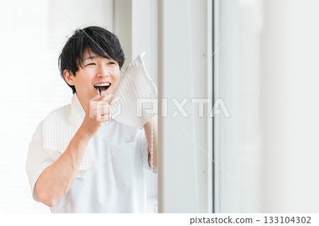 Young Asian man brushing his teeth in the morning (dental care, toothbrush, whitening, oral care) Young Asian man brushing his teeth in the morning (dental care, toothbrush, whitening, oral care) 133104302