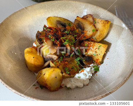 Bowl of roasted vegetables and cottage cheese. Wholesome nutrition, balance, and everyday simplicity in a mindful eating moment. Bowl of roasted vegetables and cottage cheese. Wholesome nutrition, balance, and everyday simplicity in a mindful eating moment. 133105601