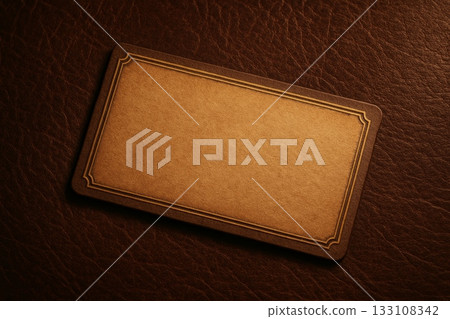 Vintage blank business card with elegant brown frame on textured leather background. Classic mockup for branding, message, or invitation. 133108342