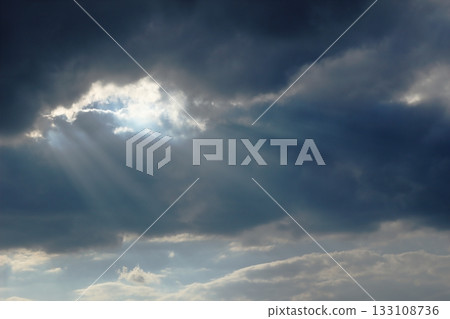 sunlight leaking through clouds sunlight leaking through clouds 133108736