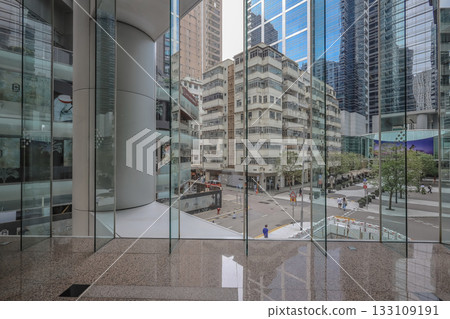 Oct 29 2025 Quarry Bay Streetscape Through Office Lobby Glass 133109191