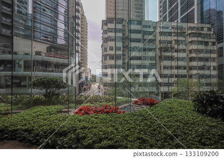 Oct 29 2025 Quarry Bay Streetscape Through Office Lobby Glass Oct 29 2025 Quarry Bay Streetscape Through Office Lobby Glass 133109200