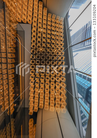 Oct 29 2025 Golden Honeycomb Wall Installation With Repeating Square Opening Oct 29 2025 Golden Honeycomb Wall Installation With Repeating Square Opening 133109204