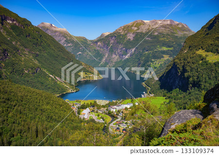 Geirangerfjord and Village Surrounded by Mountains in Norway Geirangerfjord and Village Surrounded by Mountains in Norway 133109374