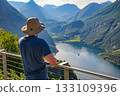 Tourist Overlooking Geiranger Fjord in Norway 133109396