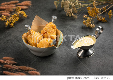 Fried chicken drumsticks in crispy breading 133109479