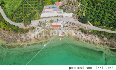 Lake Kournas in Crete aerial view of pedal boat rental clear water and scenic Greek nature. Lake Kournas in Crete aerial view of pedal boat rental clear water and scenic Greek nature. 133109562