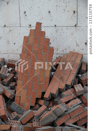 Collapsing Brick Wall Debris on Construction Site Collapsing Brick Wall Debris on Construction Site 133110759