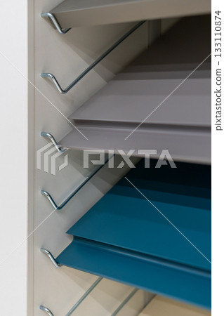 A close-up view of kitchen furniture facade samples 133110874