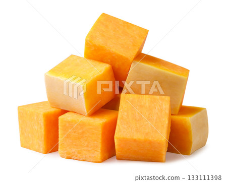 Pile of pumpkin pieces close-up on a white background. Isolated 133111398