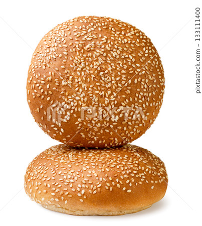 Two burger buns with sesame seeds on a white background. Isolated Two burger buns with sesame seeds on a white background. Isolated 133111400