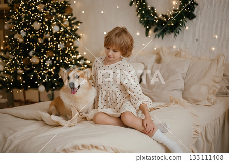 Child and Dog Enjoying Cozy Christmas Morning Together Child and Dog Enjoying Cozy Christmas Morning Together 133111408