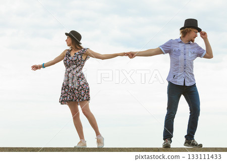 Couple pulls in different directions. Couple pulls in different directions. 133111433