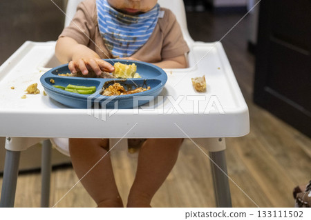 Baby Eating in High Chair with Divided Plate 133111502