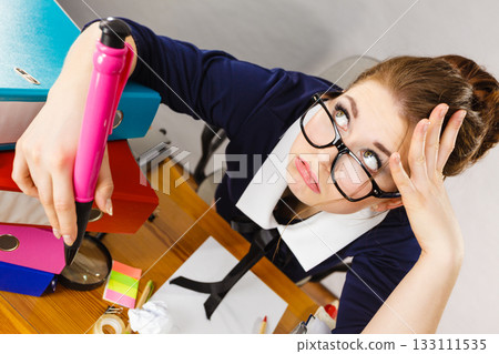 Sleepy business woman in office working Sleepy business woman in office working 133111535