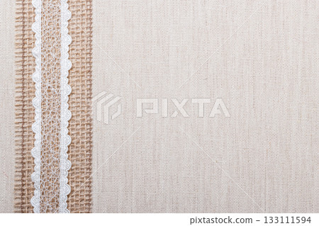 Lace frame on linen cloth background Lace frame on linen cloth background 133111594