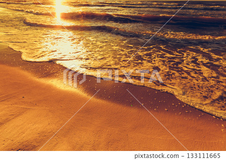 Beatiful sunset with clouds over sea and beach Beatiful sunset with clouds over sea and beach 133111665