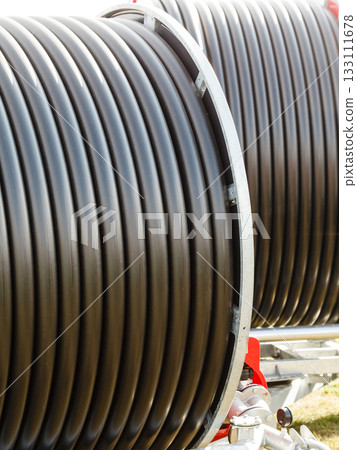 Detailed closeup of flexible plastic hose Detailed closeup of flexible plastic hose 133111678
