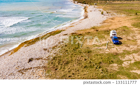 Caravan trailer camping on coast. Aerial view 133111777