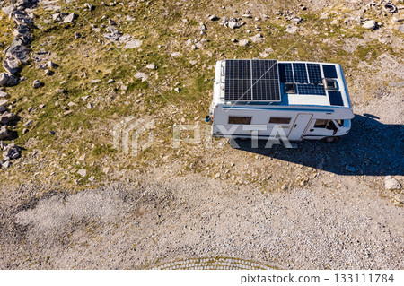 Caravan solar panels on roof camping on nature. Aerial view Caravan solar panels on roof camping on nature. Aerial view 133111784