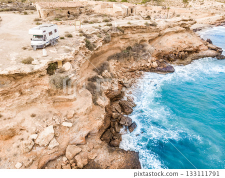 Camper on coast in Spain. Aerial view 133111791