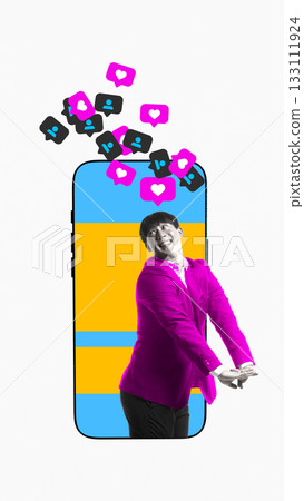 Playful poster of joyful man posing in front of giant smartphone bursting with icons 133111924