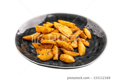 Isolated roasted potato wedges plate 133112169