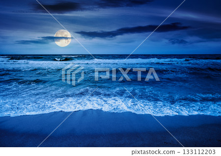 black sea waves crashing sandy beach at night. summer vacation on a windy weather under dark cloudy sky in full moon light. view of dramatic seascape. background for investment or abstract concepts black sea waves crashing sandy beach at night. summer vacation on a windy weather under dark cloudy sky in full moon light. view of dramatic seascape. background for investment or abstract concepts 133112203