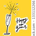 Glass of champagne with a sparkle and hand lettering Happy new year 133112266