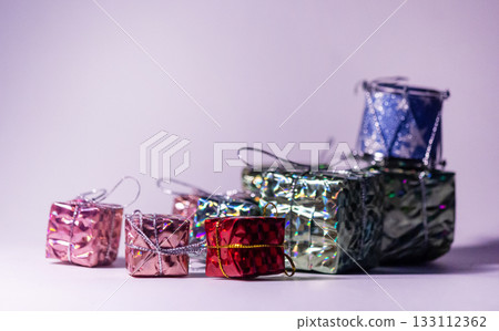 Mini boxes decorated with colorful paper create a light-hearted concept of retail and e-commerce. Mini boxes decorated with colorful paper create a light-hearted concept of retail and e-commerce. 133112362